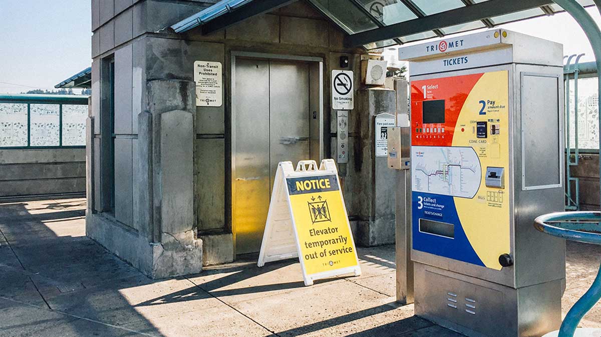 A TriMet station elevator with a sign that reads “Notice Elevator temporarily out of service”.