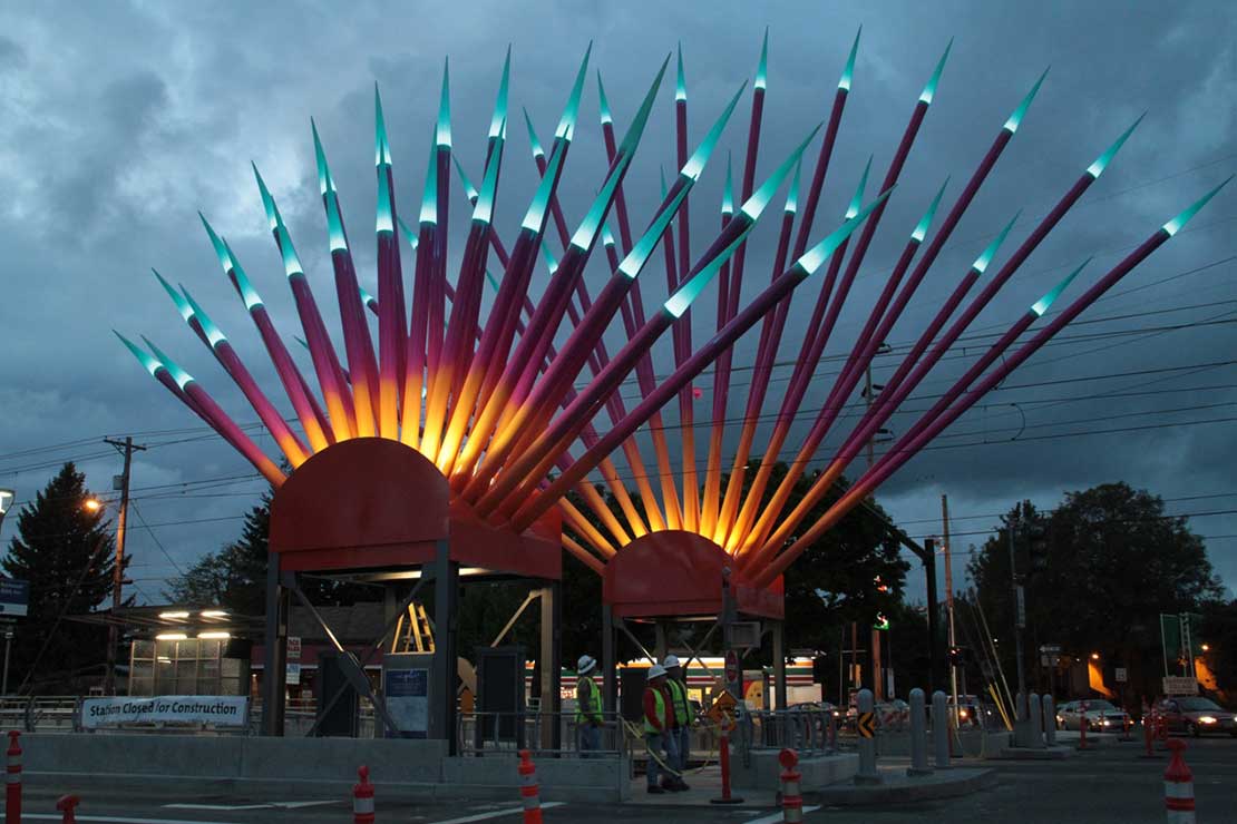 Rockwood Sunrise sculptures illuminated at dusk