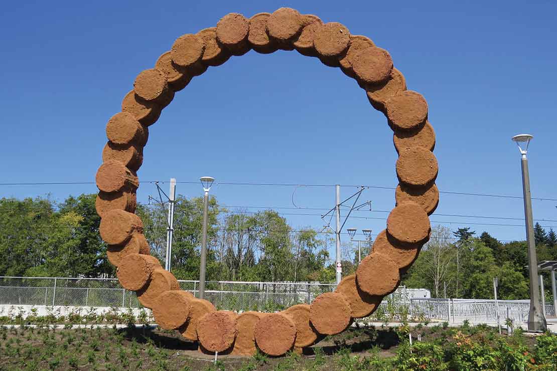 'Kerf' - cast concrete circles connected to make a tall ring