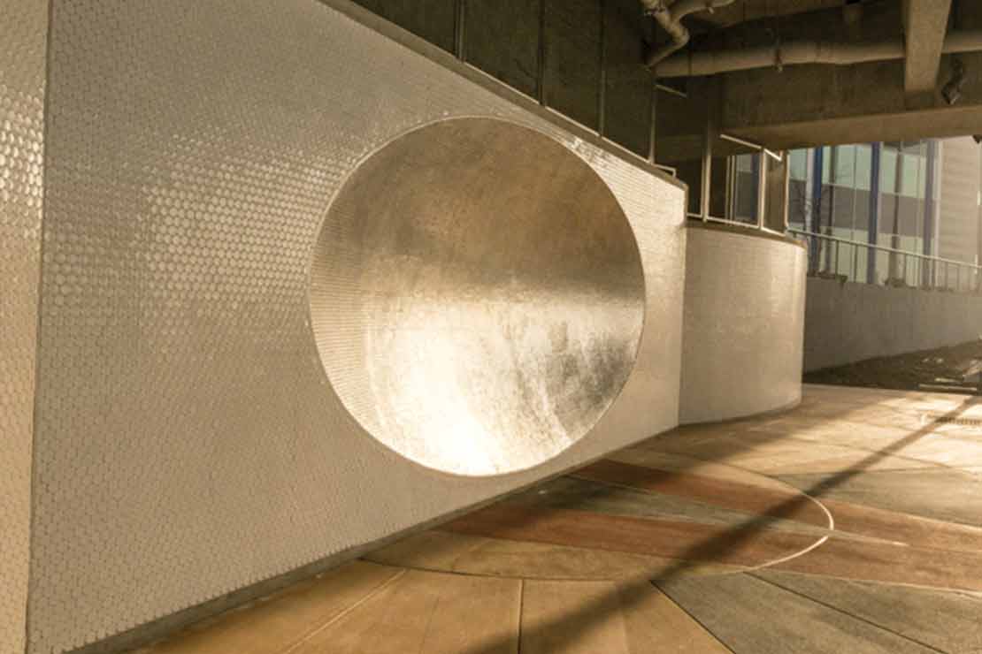 'Sonic Dish' is a concave tile sculpture inset into the wall under the Hawthorne Bridge