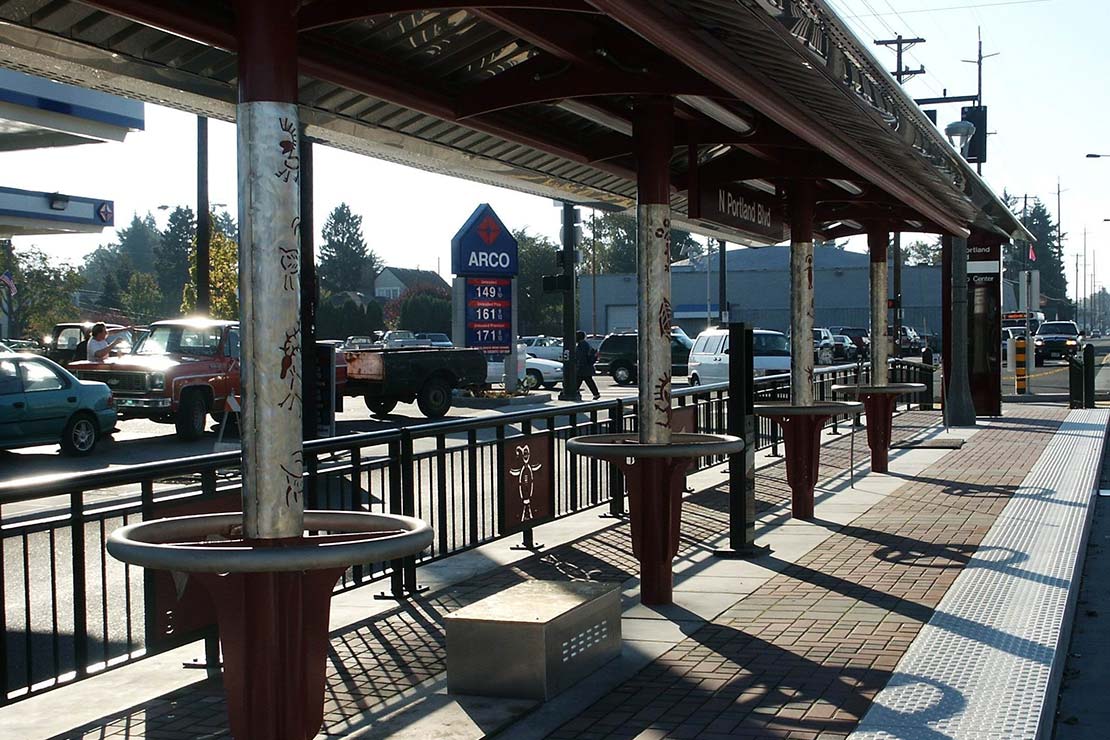 Columns with etched metal petroglyphs
