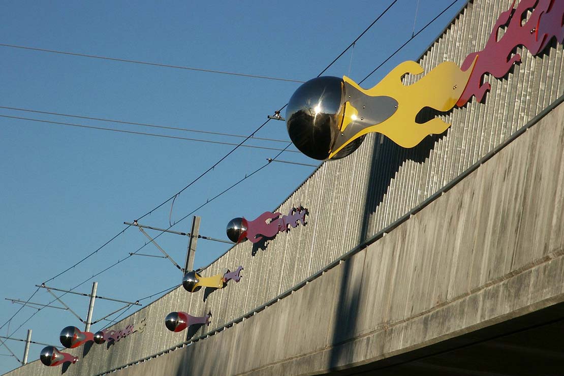 Vanport Bridge with reflective metal orbs surrounded with simulated fire